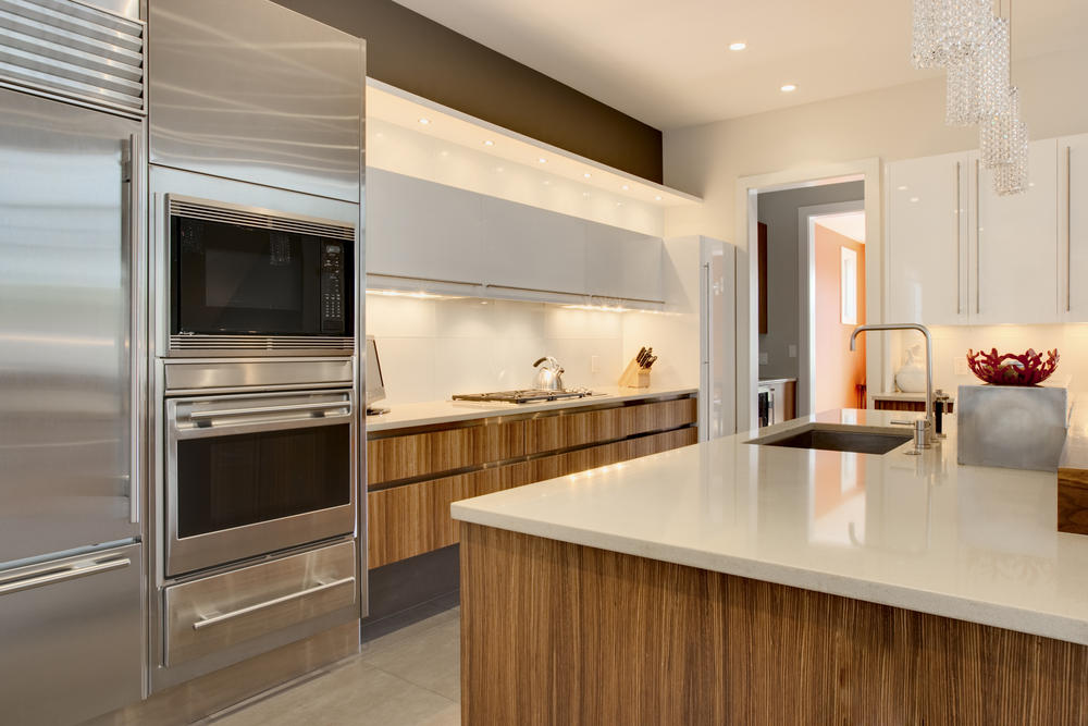 Luxury Kitchen with stainless steel appliances and wood cabinetry